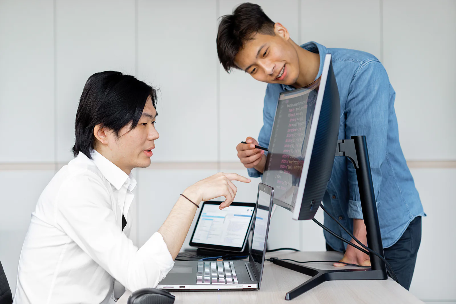 Real software team discussing a screen